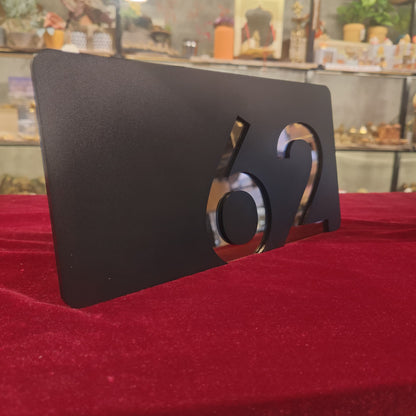 Number Behind the Black Nameplate