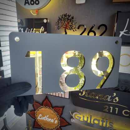 Number Behind the Black Nameplate